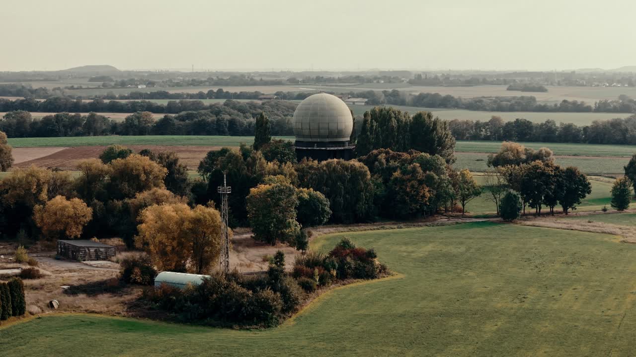 Aerial View of a Large Radar Dome in a Rural Landscape