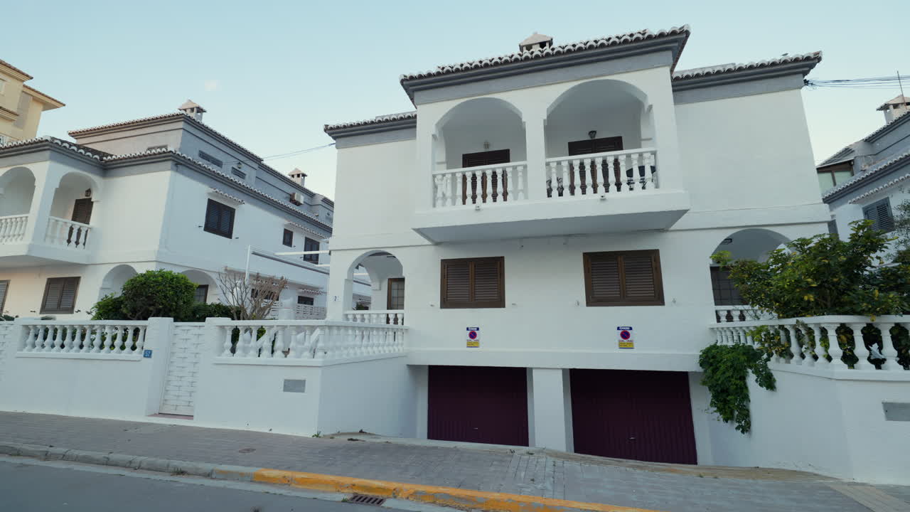 Residential houses with white facade and balconies