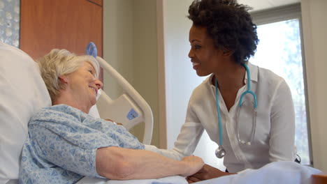 doctor talks to senior patient in hospital bed shot on r3d