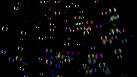 medium soap bubbles spinning slow motion black background medium sized bright soap bubbles spinning slow motion black background