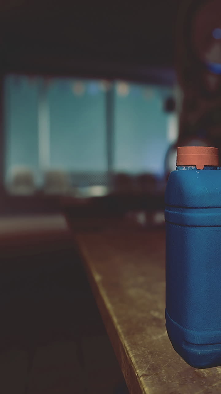 Container on a counter in a room during evening hours