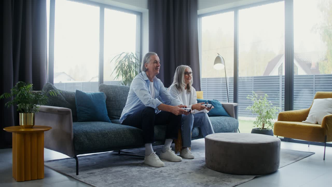 Senior Couple Playing Video Games at Home