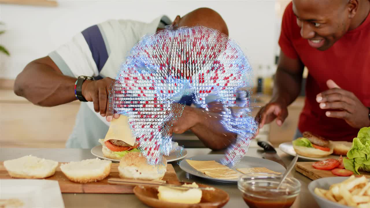 Senior picking up cheese and placing on burger, son prepping, globe obscuring hands, food prep