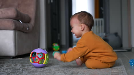 baby playing with a ball