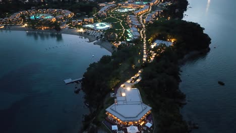 aerial view of illuminated ikos odisia, a luxurious seaside escape in corfu, greece