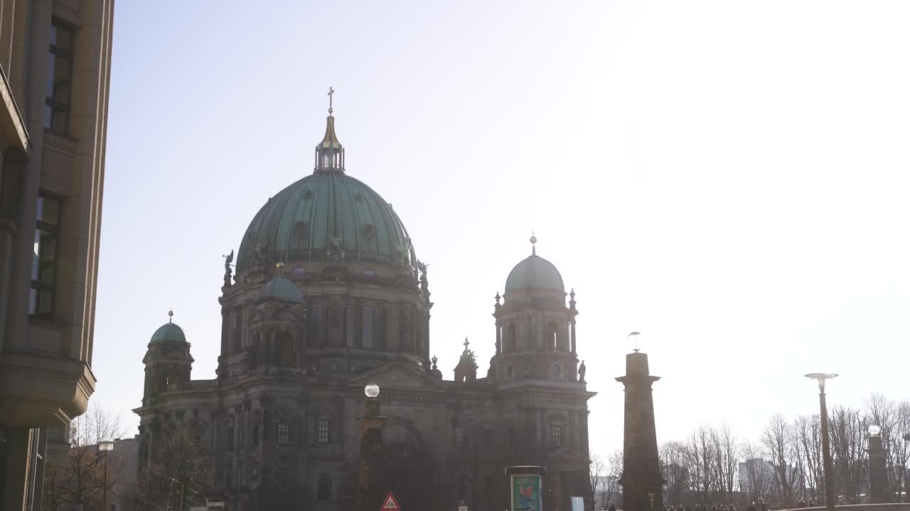 A morning shot of one of Berlin's main attractions, the "Berliner Dom".
In the background you can see the beautiful, warm summer sun and also a few birds flying around aesthetically and calmly.