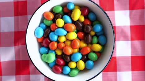 top view of color chocolate in a bowl on table