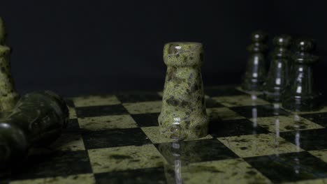 chess game with green stone pieces