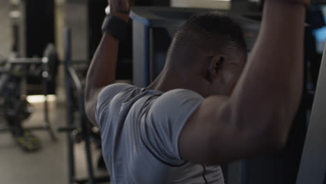 man working out on a seated row machine at the gym