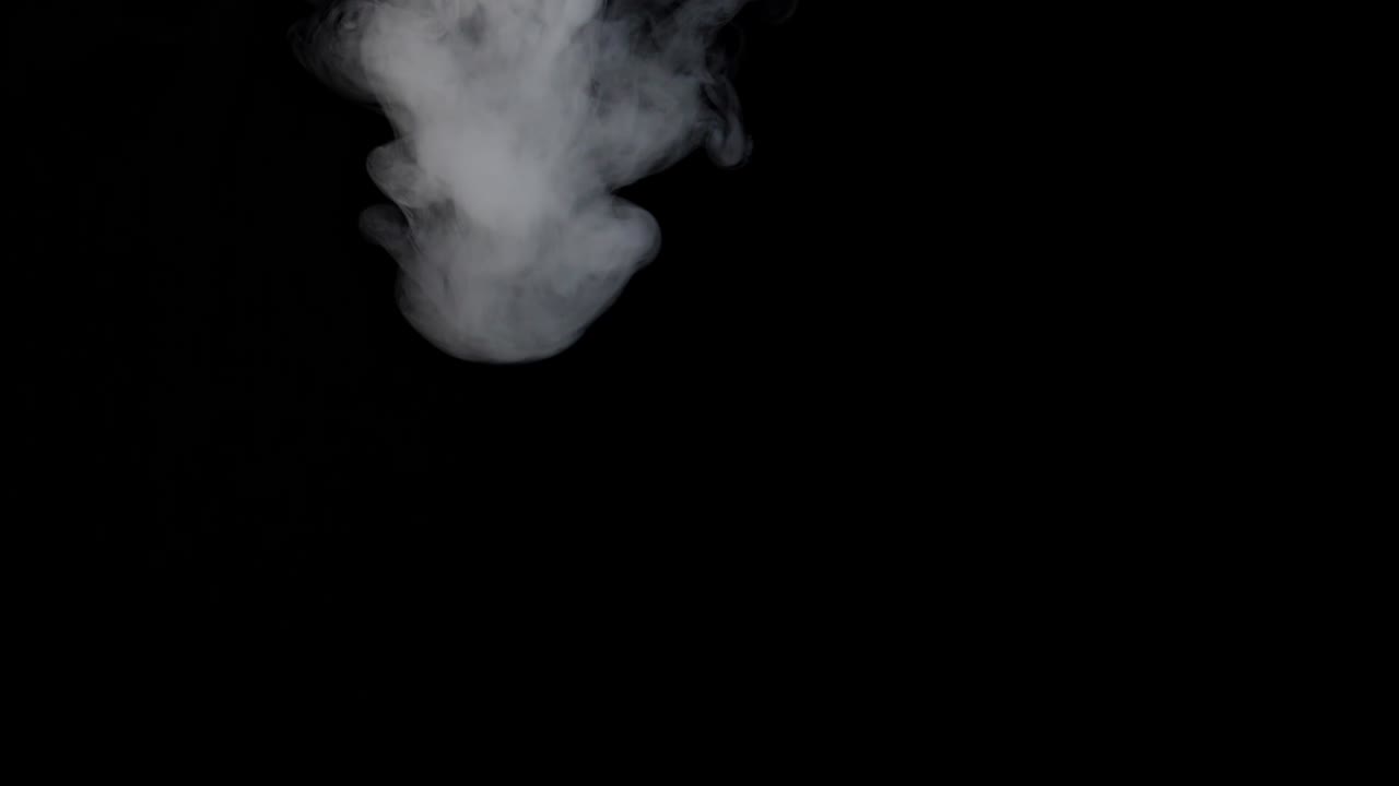 White Steam Spins And Rises From The Pan, White Smoke Rises From A Large Pot, Which Is Located Behind The Frame, Isolated Seamless Loop Black Background, , Slow Motion
