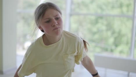 young girl breakdancing in modern studio