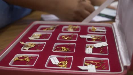 hallmarked gold ornaments with tags, selective focus