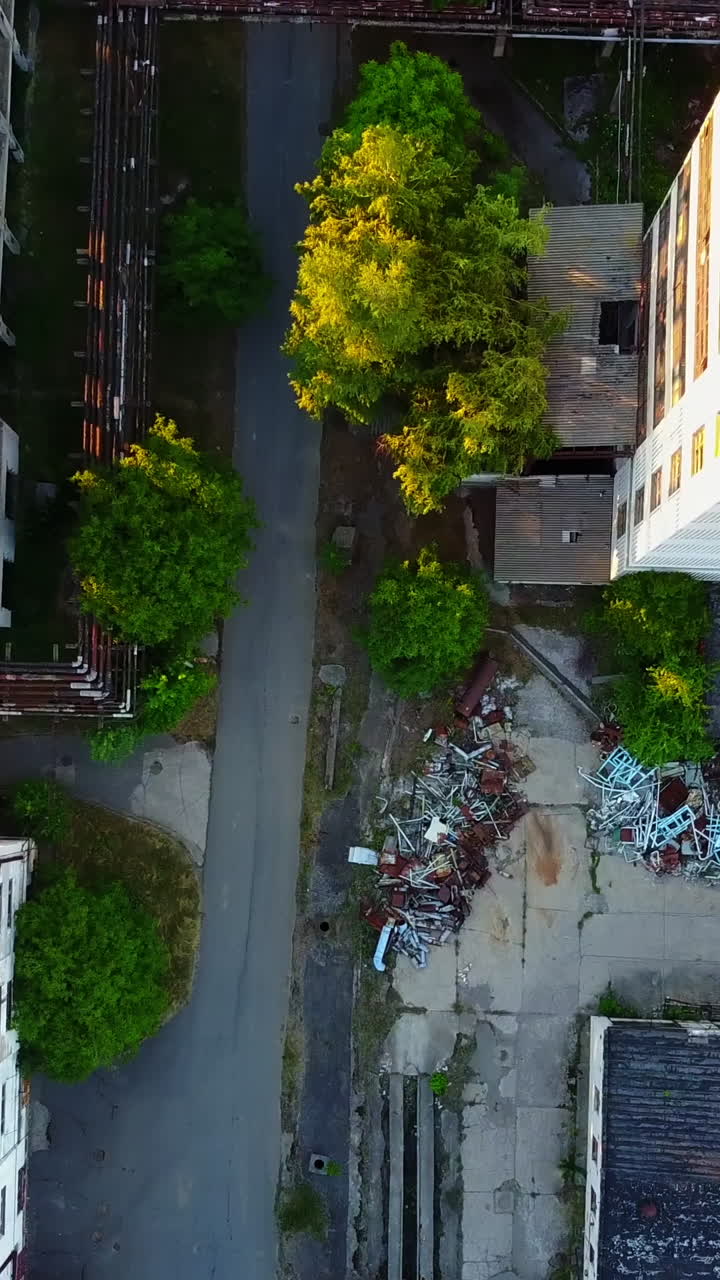 Old Abandoned Factory Buildings. Abandoned old factory buildings with closed door and windows Vertical video