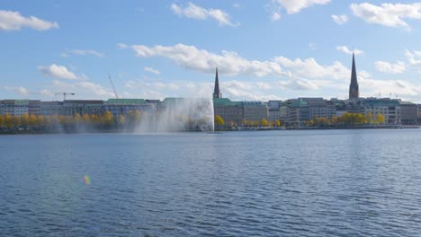 water fountain in urban lake with sunny weather