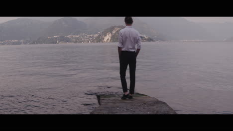 man standing by the lake
