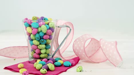 mug filled with painted chocolate easter eggs