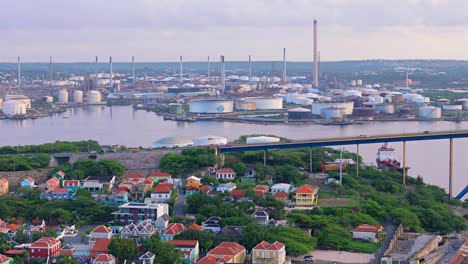 trucking pan across queen juliana bridge, willemstad curacao with oil refinery behind