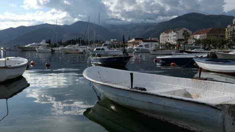 Boats-docked-at-marina,-picturesque,-idyllic-seaside-town,-Tivat,-Montenegro