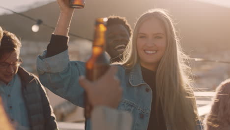 happy-group-of-friends-celebrating-rooftop-party-making-toast-drinking-beer-enjoying-reunion-celebration-on-weekend-social-gathering-at-sunset