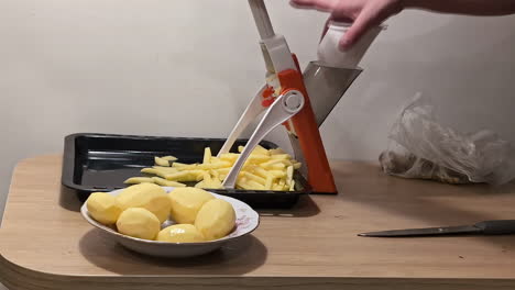 timelapse shot of slicing potatoes on a v-blade to grill crispy french fries at home