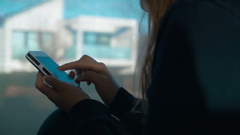 woman typing a message on smartphone