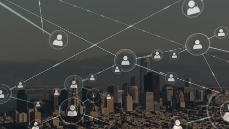 animation of network of profile icons against aerial view of cityscape