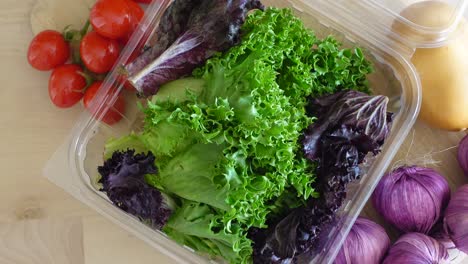 assorted fresh vegetables in plastic containers