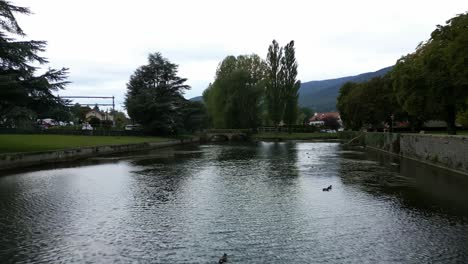 Push in drone shot of Venoge river in L'Isle in Canton of Vaud Switzerland