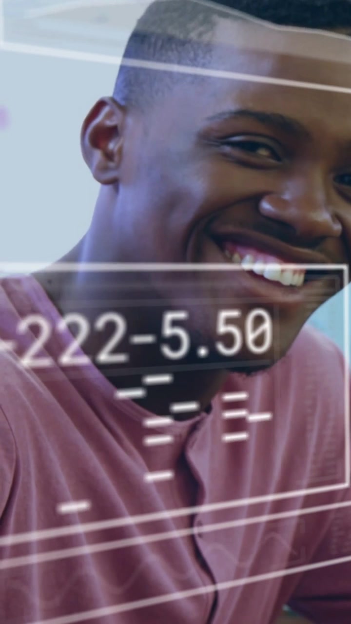 Vertical video: Man leaning forward using tech UI and analyzing data for insights with HUDs growing
