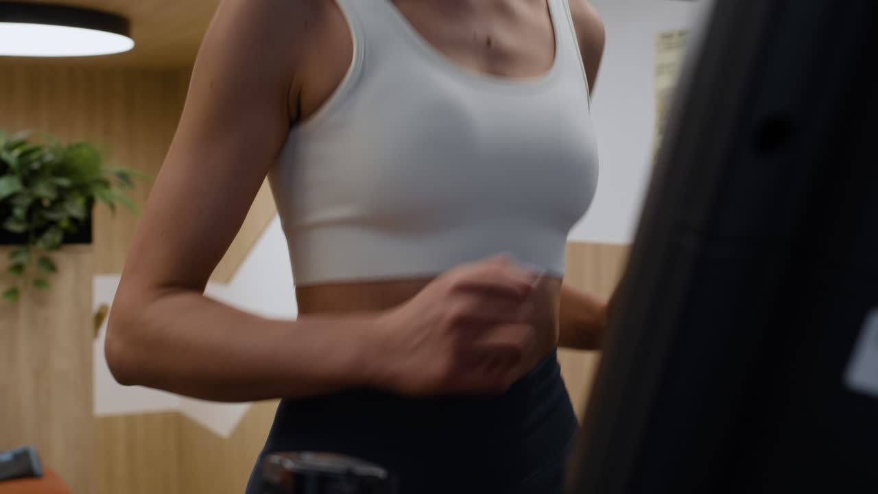 Woman Running on a Treadmill