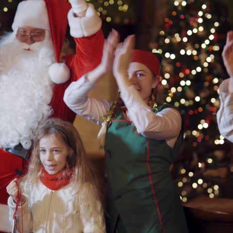Santa Claus dancing with children