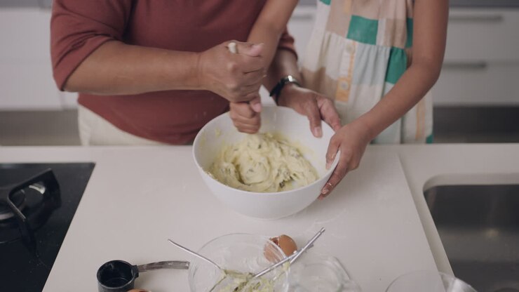 Grandmother and Granddaughter Baking Together