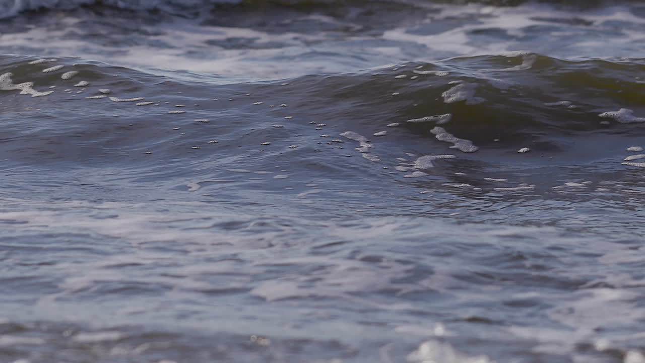 Sea waves rushing at the beach