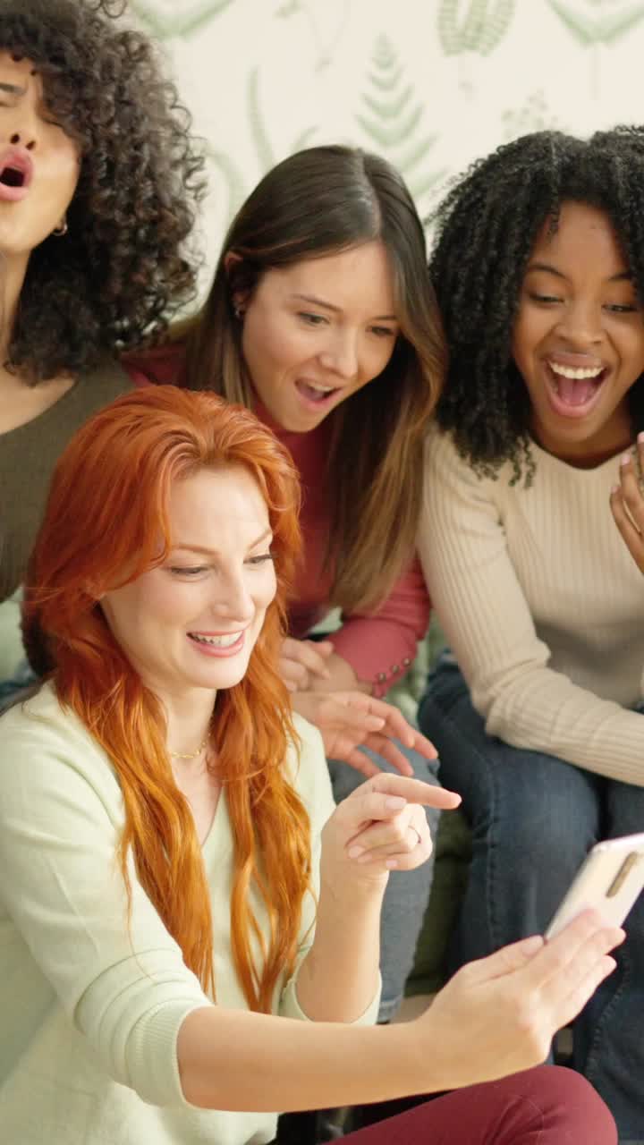 Group of friends enjoying something on a smartphone
