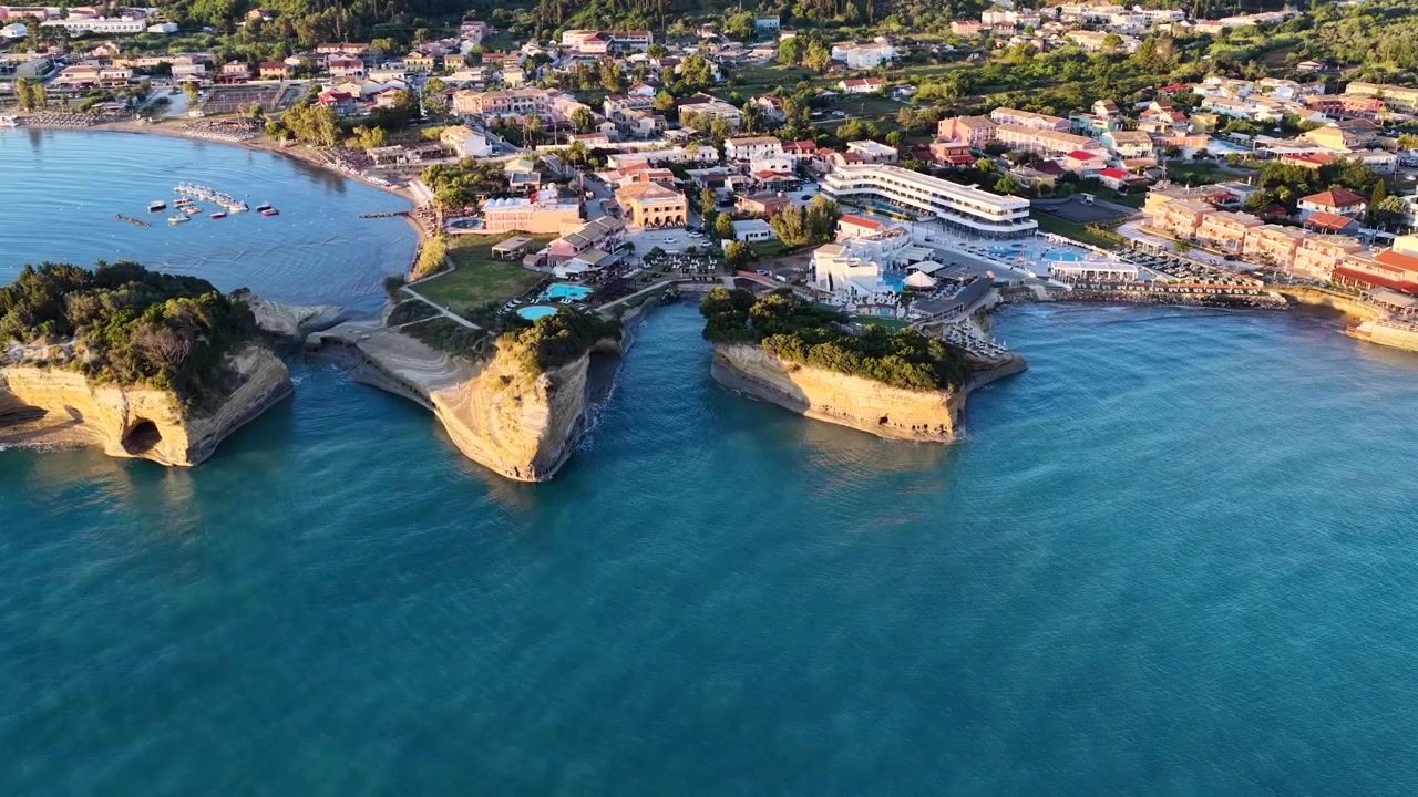 Drone Flyover of Canal d'Amour Inlets and Caves in Sidari North Corfu Greece - Aerial Close Up of Sandstone Cliffs and Clear Blue Ionian Water
