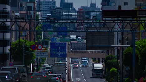 a timelapse of the traffic jam at the urban street in tokyo long shot