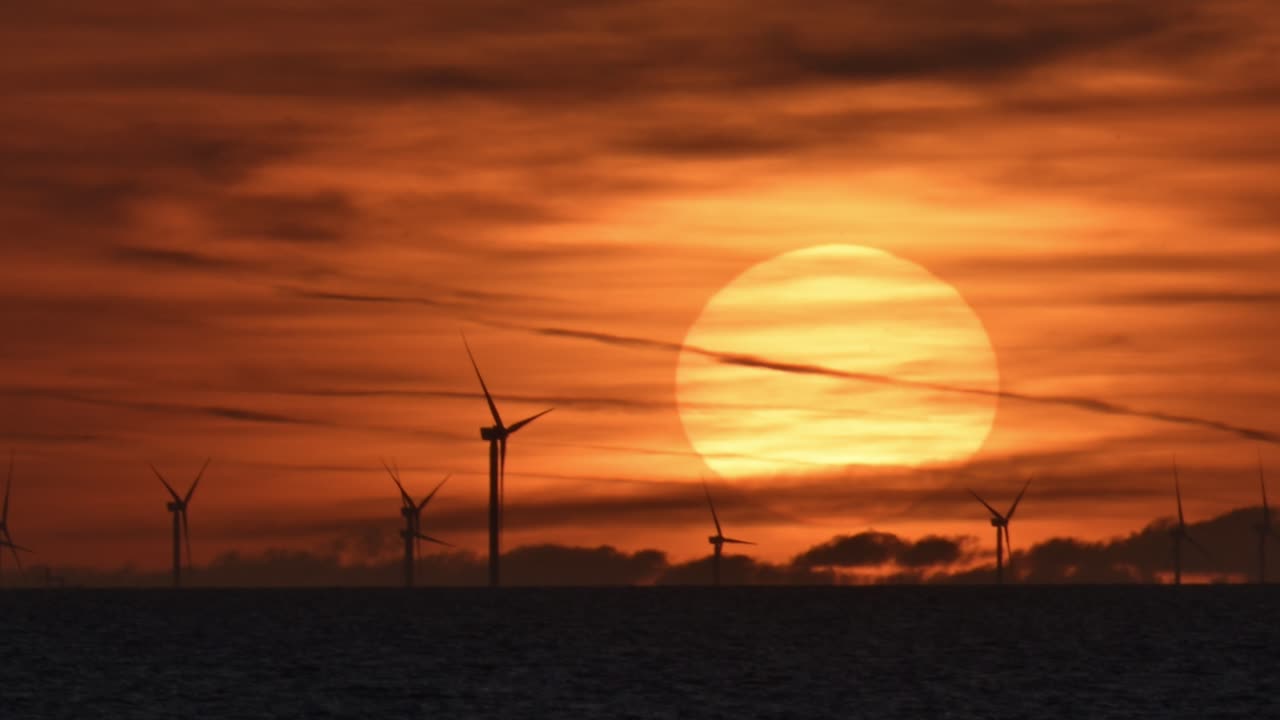 Offshore wind farm and beautiful sunset