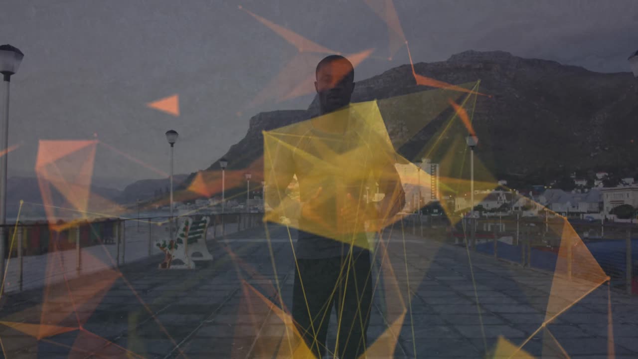 animación de formas geométricas sobre un hombre afroamericano en forma corriendo por el paseo marítimo