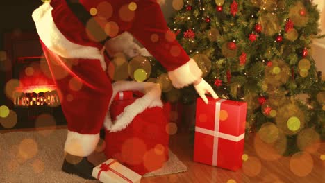 animación de puntos de luz sobre el árbol de navidad y santa claus con regalos.