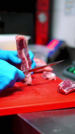 preparing meat in a kitchen