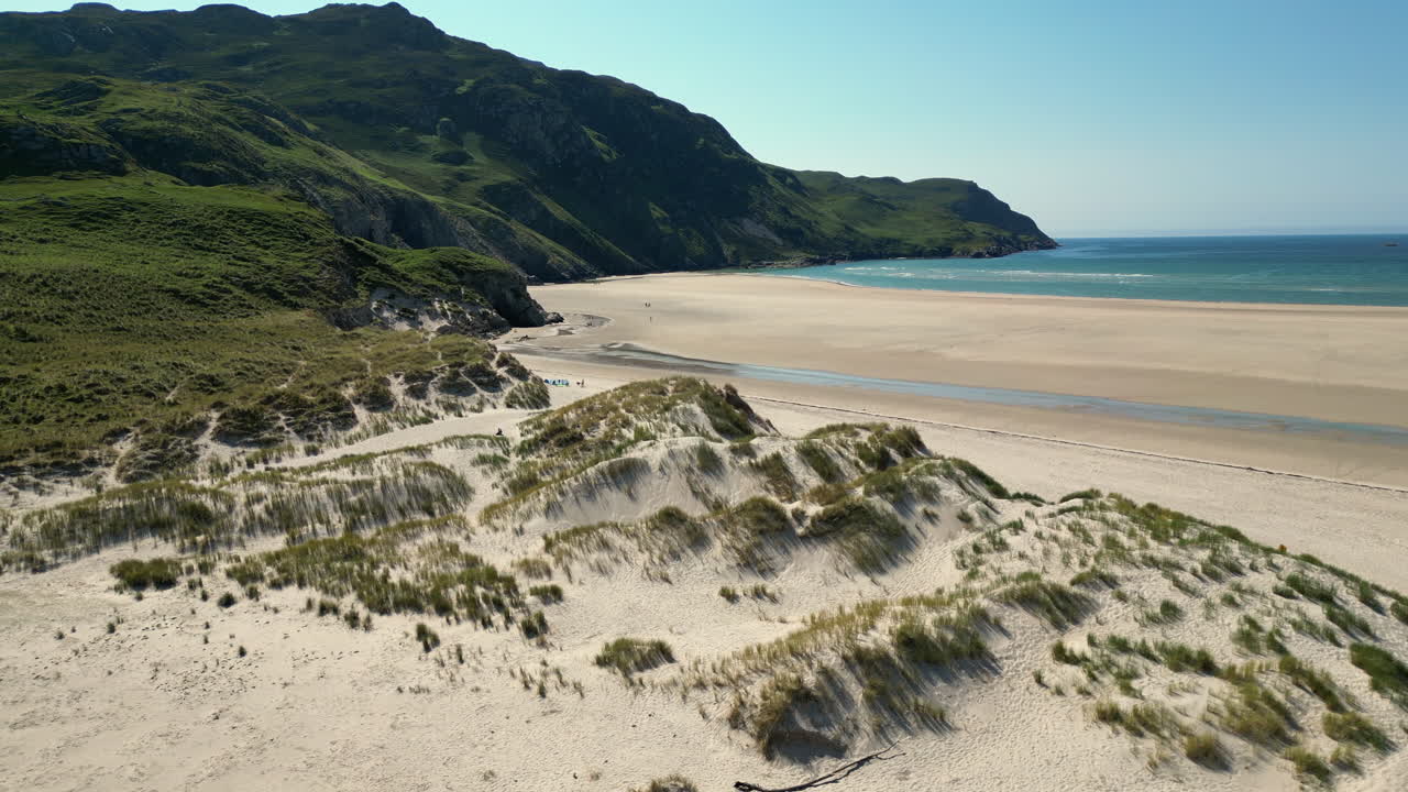 Fly by over Donegal's Maghera Beach on a quiet summer day