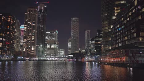 Illuminated-Buildings-at-night-over-the-Thames-River-in-Canary-Wharf