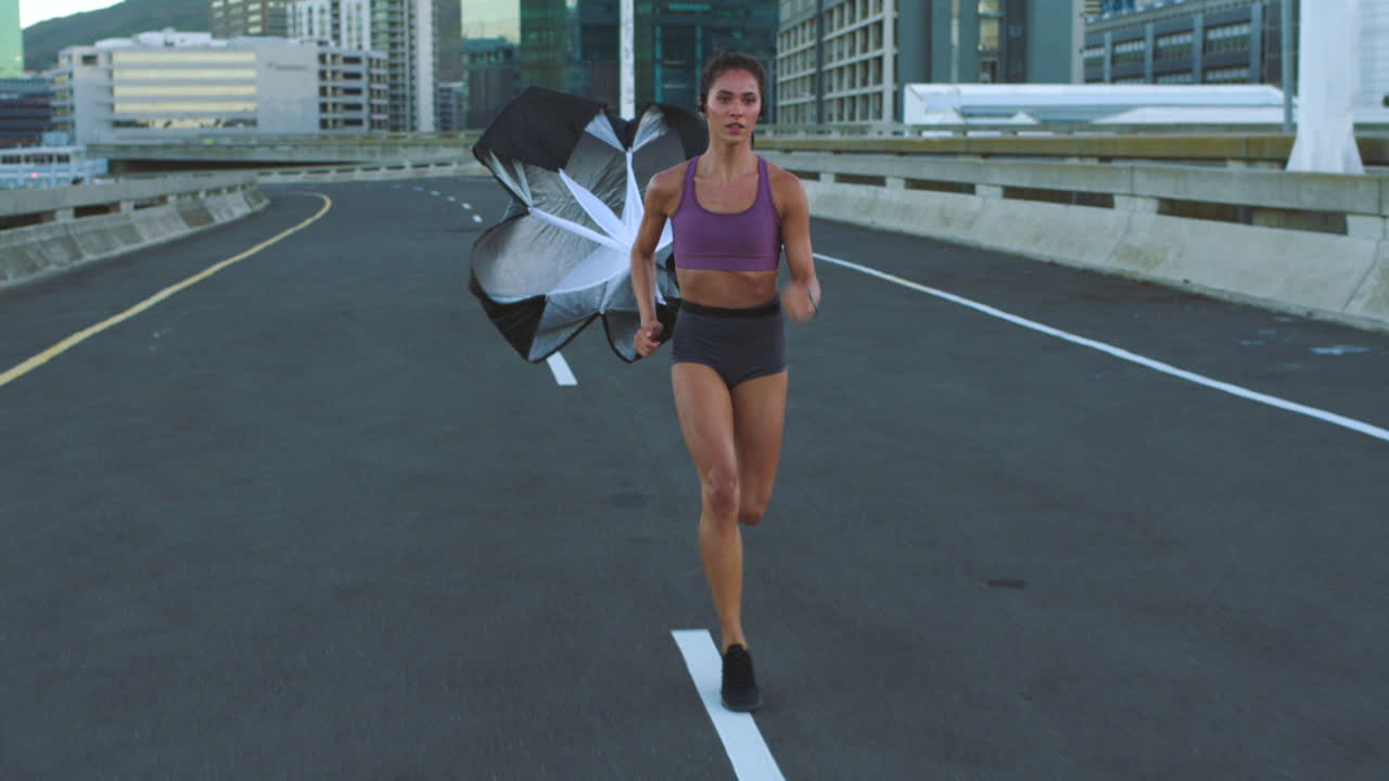 Woman Running on a Road with a Flag