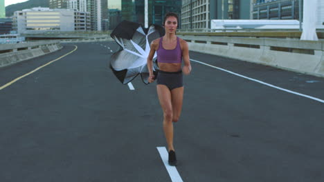 woman running on a road with a flag