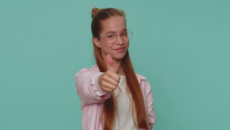 pretty teen young girl showing thumbs up and nodding in approval, successful good amazing work job