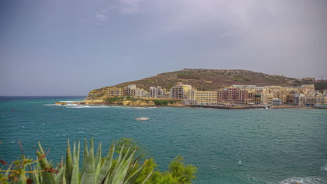 seaside village on the island coast of malta - time lapse