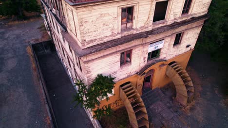 Abandoned-Medical-Building-of-European-Heritage-Aerial-Drone-Establishing-Shot,-Ex-Hospital-Old-Clinic