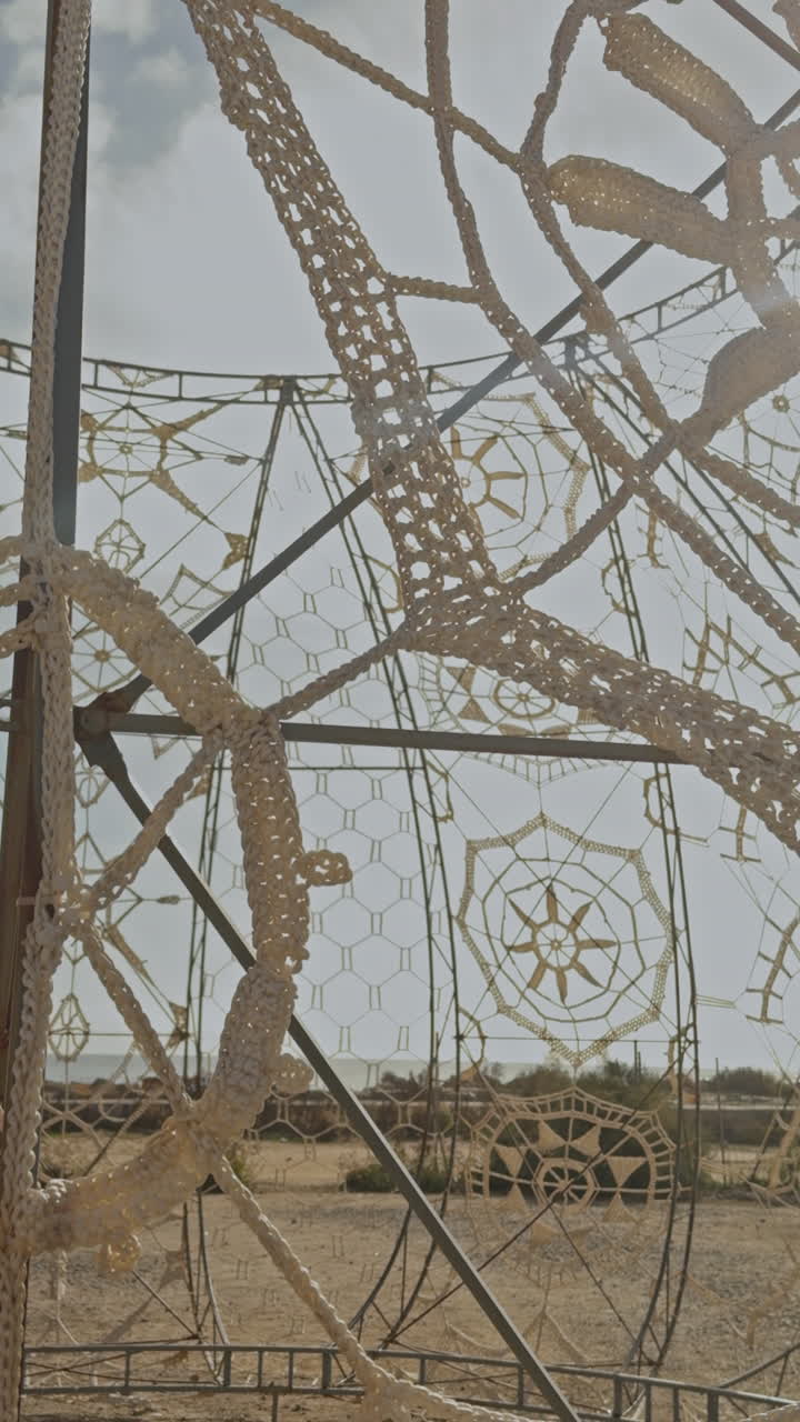 woven art pattern by the beach in barcelona in vertical
