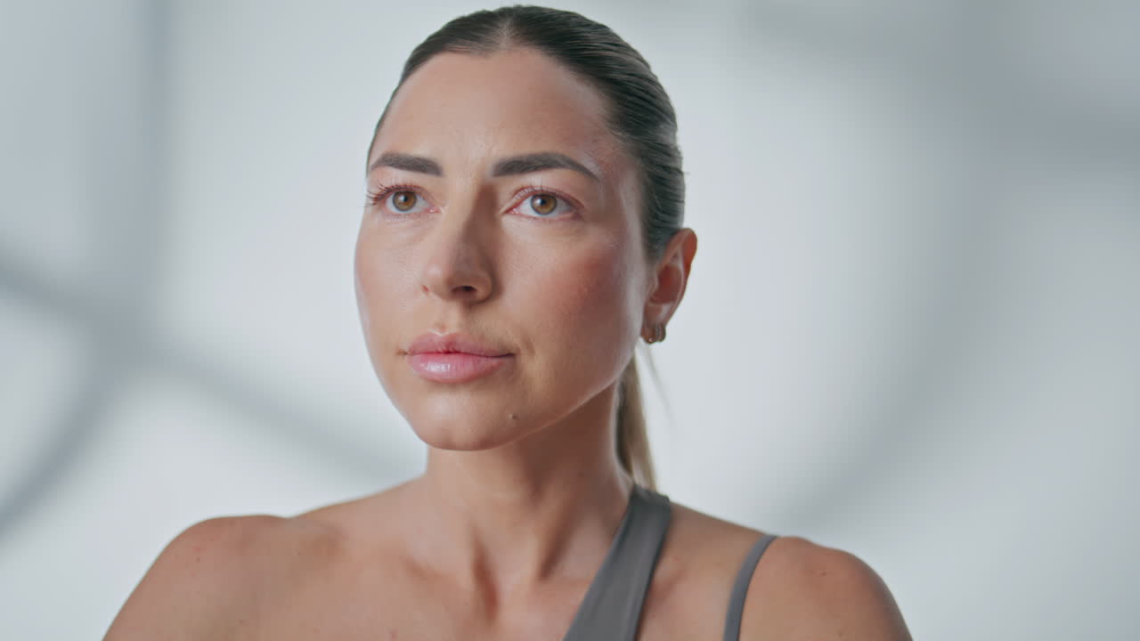 Yogi woman practicing breathing exercises indoors closeup. Lady inhaling asana
