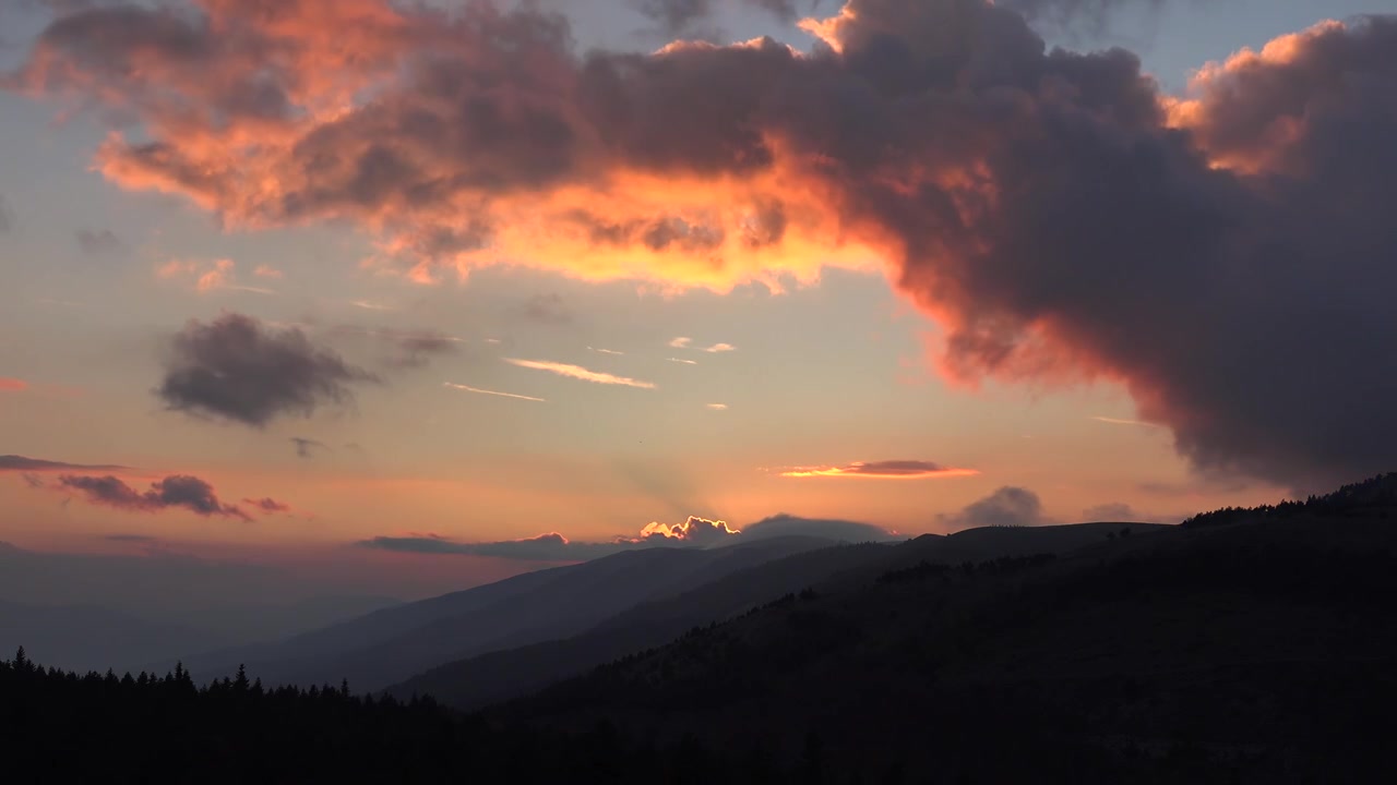 Time Lapse of Dramatic Sunset Over Mountain Range